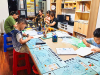 成都市新都区斑竹园街道廖家湾社区关工委开展公益课堂书法活动